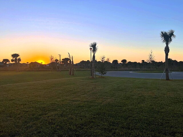 yard at dusk with a water view