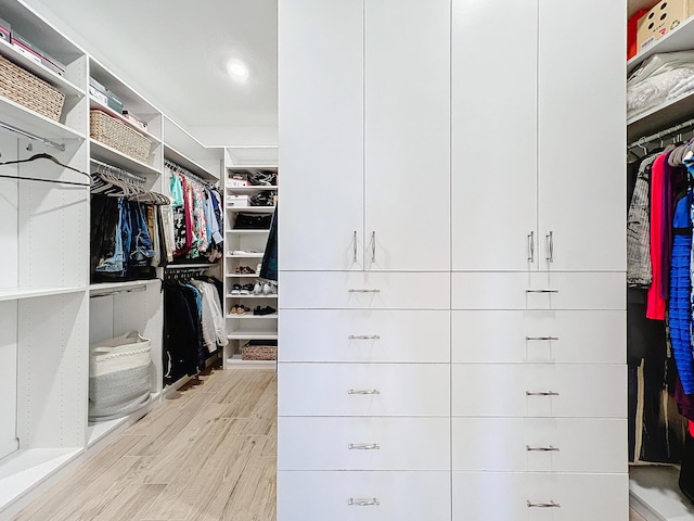 walk in closet featuring light wood-type flooring