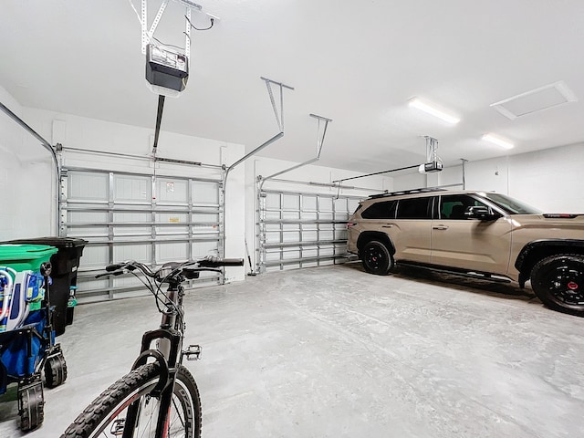 garage featuring a garage door opener