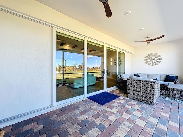 view of patio / terrace with an outdoor living space and ceiling fan