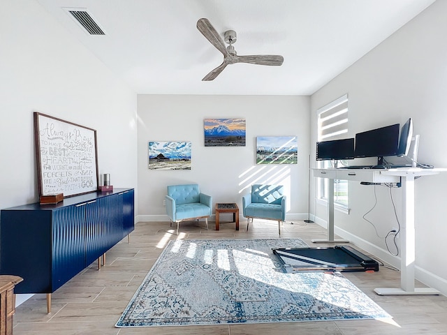 office space featuring ceiling fan and light hardwood / wood-style flooring