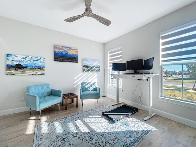 sitting room featuring light wood-type flooring and ceiling fan