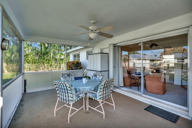 sunroom featuring ceiling fan