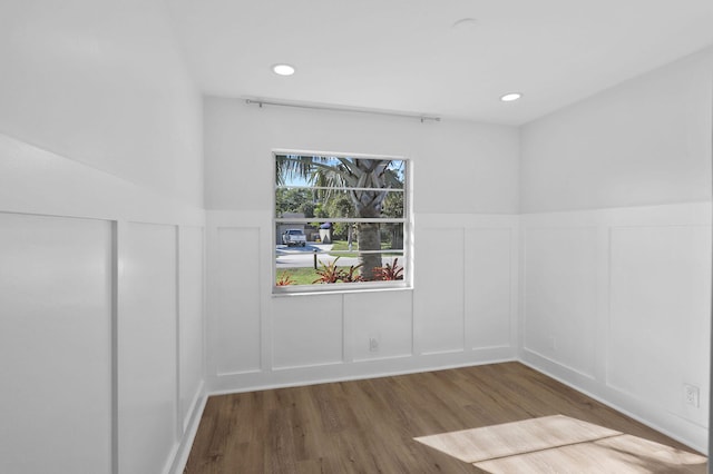 unfurnished room featuring dark wood-type flooring