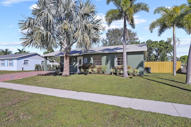 single story home featuring a front yard and cooling unit