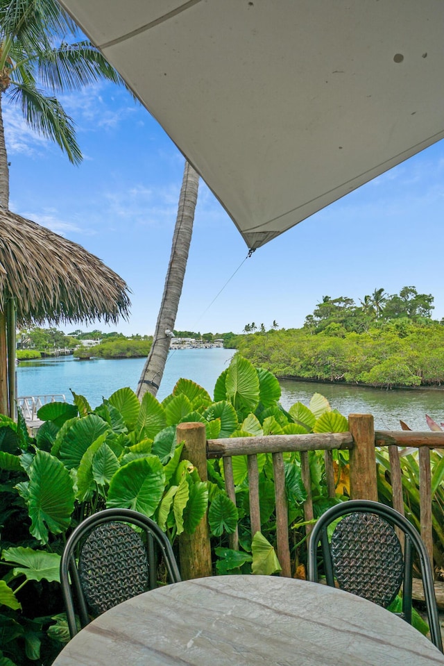 balcony featuring a water view