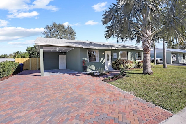 view of front of house featuring a front yard and a carport