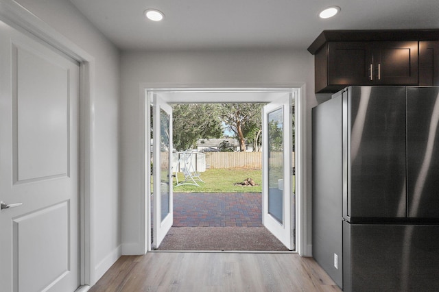 entryway with light hardwood / wood-style flooring