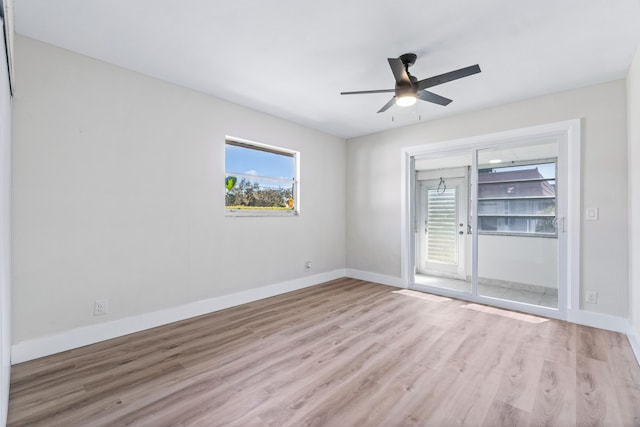 empty room featuring ceiling fan and light hardwood / wood-style flooring