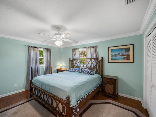 bedroom featuring ceiling fan, a closet, and wood-type flooring