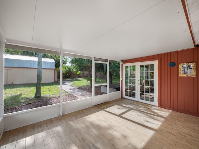 unfurnished sunroom featuring a healthy amount of sunlight