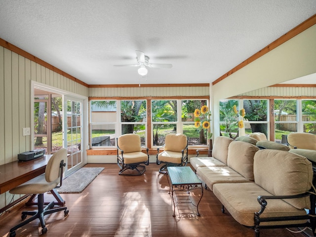 sunroom / solarium featuring ceiling fan