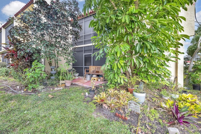 view of yard with a lanai and a patio