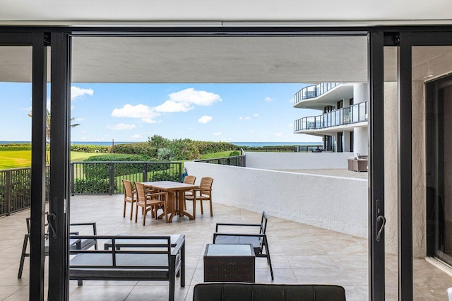 view of patio with a water view