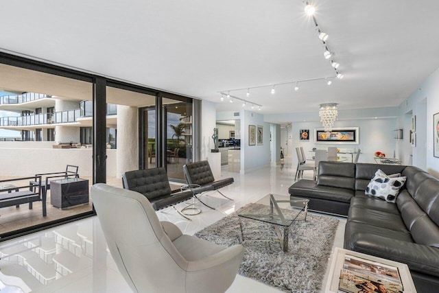 tiled living room with a chandelier and expansive windows