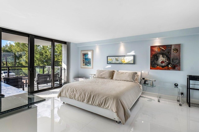 bedroom featuring access to outside, expansive windows, and light tile patterned floors