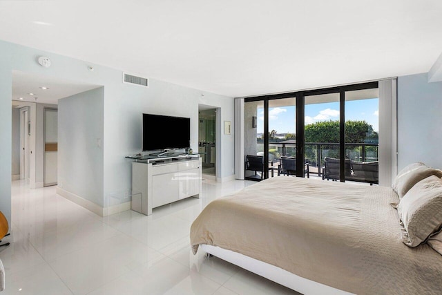 tiled bedroom featuring access to exterior and expansive windows