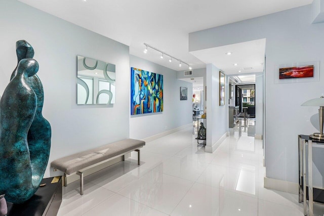 corridor featuring light tile patterned flooring