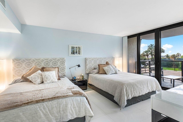 bedroom featuring access to outside and floor to ceiling windows