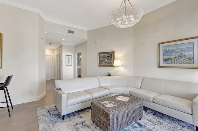 living room featuring a chandelier and ornamental molding