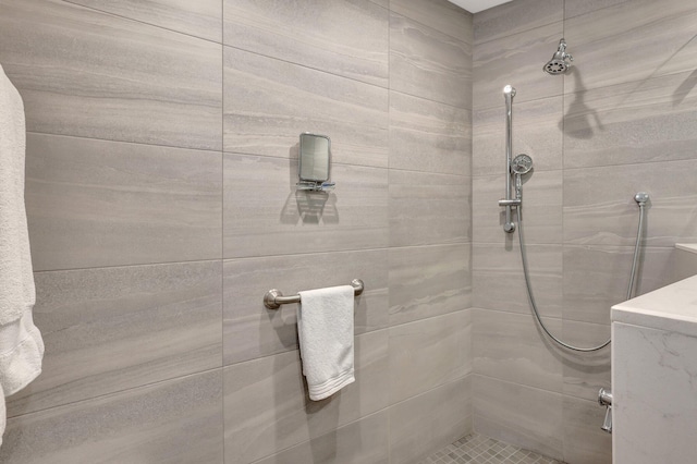 bathroom with tiled shower