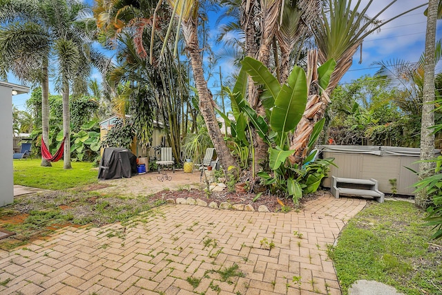 view of patio / terrace with a hot tub