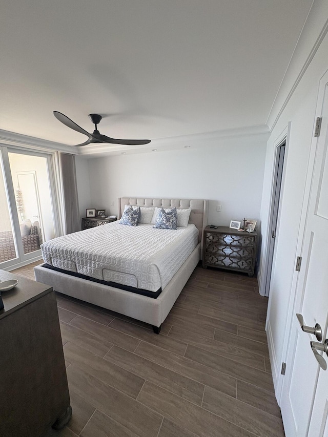 bedroom with ceiling fan and crown molding