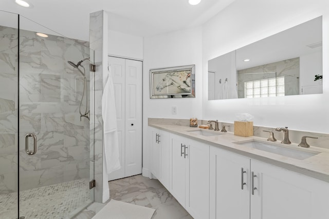 bathroom with vanity and walk in shower