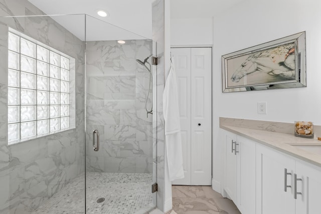 bathroom with vanity and walk in shower