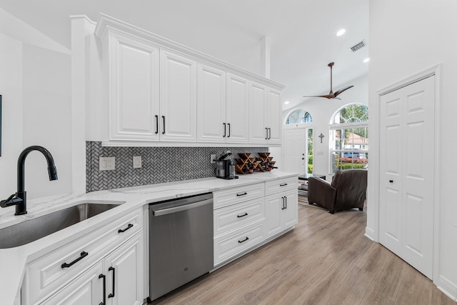 kitchen featuring dishwasher, white cabinetry, ceiling fan, and sink