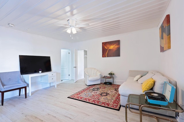 living room featuring ceiling fan and light wood-type flooring