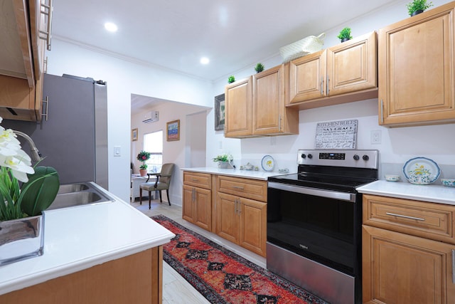 kitchen with appliances with stainless steel finishes, light wood-type flooring, a wall mounted AC, and a barn door