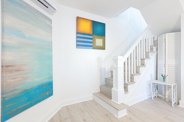 staircase with hardwood / wood-style flooring