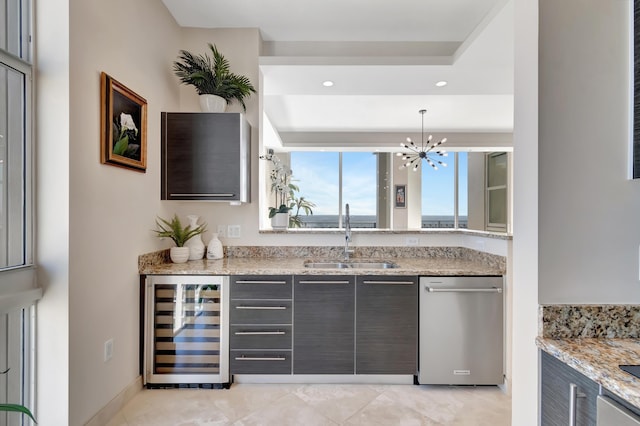 bar featuring gray cabinetry, beverage cooler, sink, dishwasher, and hanging light fixtures