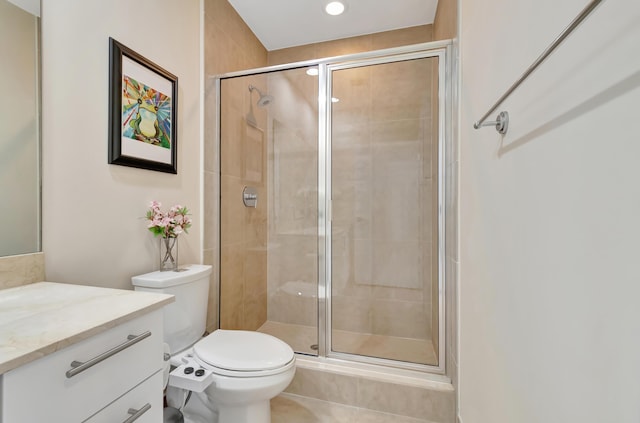 bathroom with tile patterned flooring, vanity, toilet, and an enclosed shower