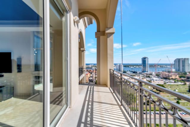 balcony featuring a water view