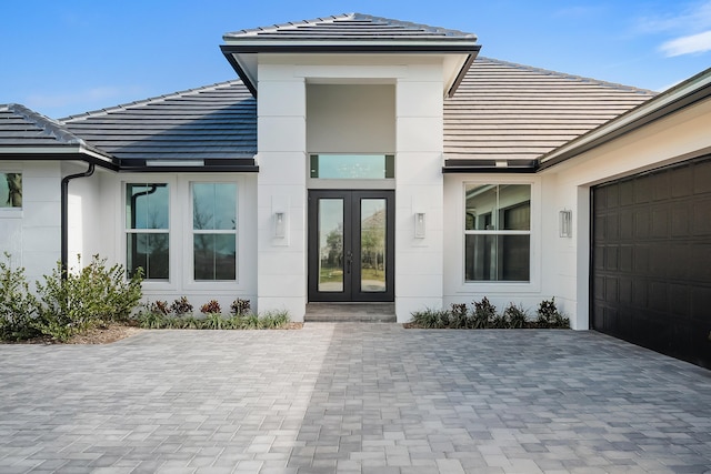 property entrance featuring french doors