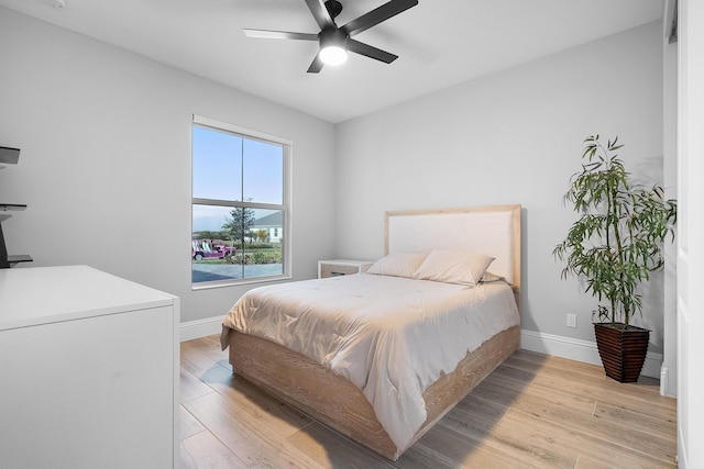 bedroom featuring light hardwood / wood-style floors and ceiling fan