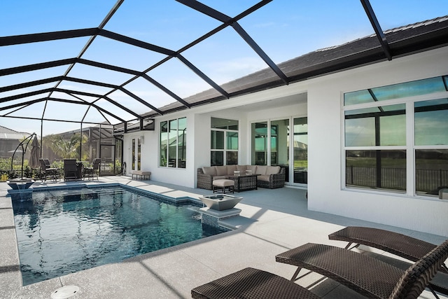 view of swimming pool featuring pool water feature, an outdoor hangout area, glass enclosure, and a patio