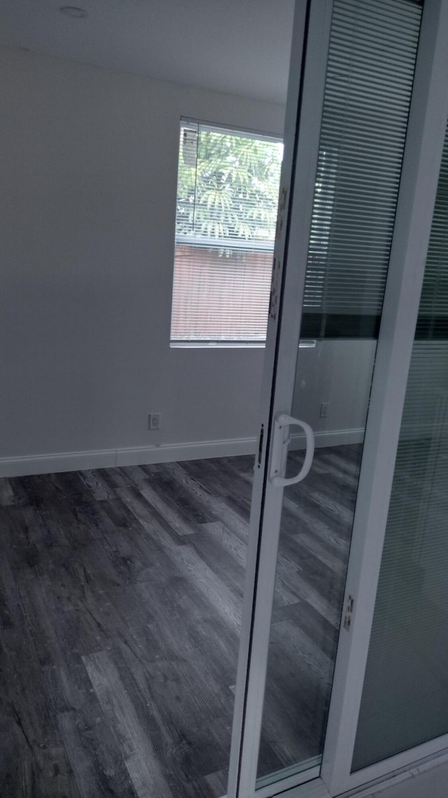 spare room featuring dark hardwood / wood-style floors