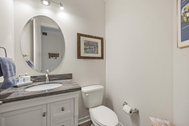 bathroom with toilet and vanity