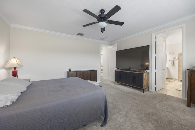 carpeted bedroom with ceiling fan, connected bathroom, and ornamental molding