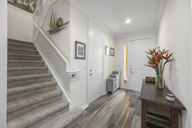 entrance foyer featuring dark hardwood / wood-style floors and ornamental molding