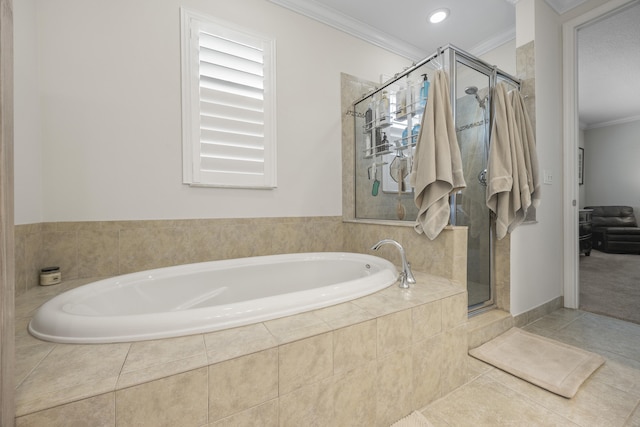 bathroom featuring tile patterned flooring, crown molding, and plus walk in shower