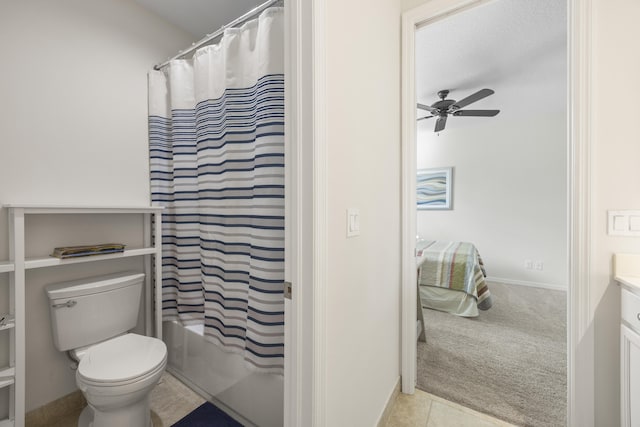 full bathroom with toilet, vanity, tile patterned flooring, ceiling fan, and shower / tub combo