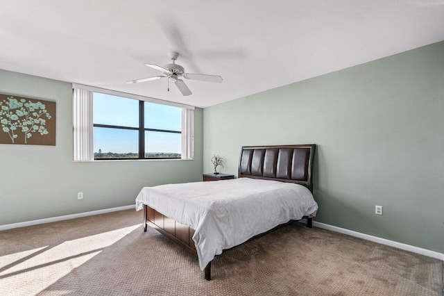 bedroom with ceiling fan and light colored carpet