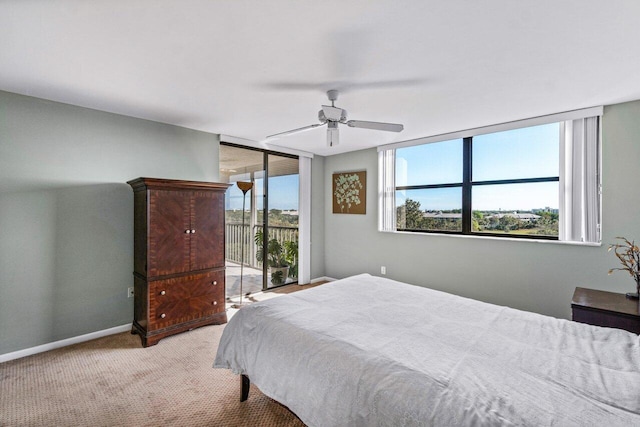 bedroom featuring ceiling fan, access to exterior, and light colored carpet