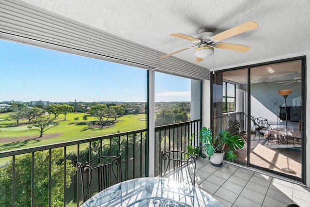 sunroom / solarium with ceiling fan