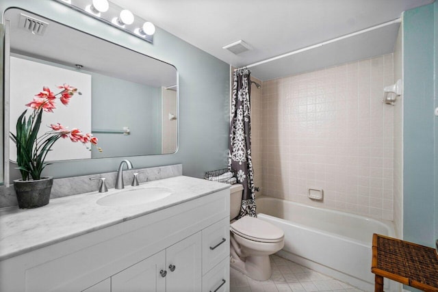 full bathroom with vanity, shower / tub combo, and toilet