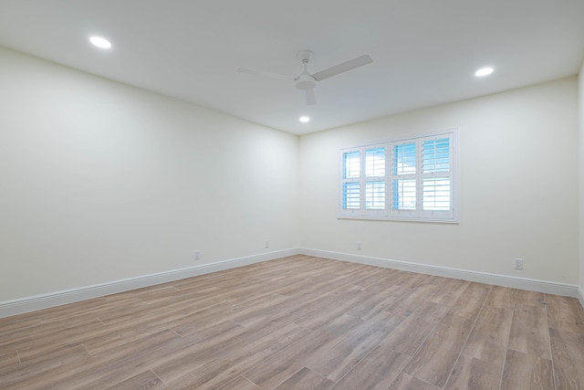 spare room featuring ceiling fan and light hardwood / wood-style floors